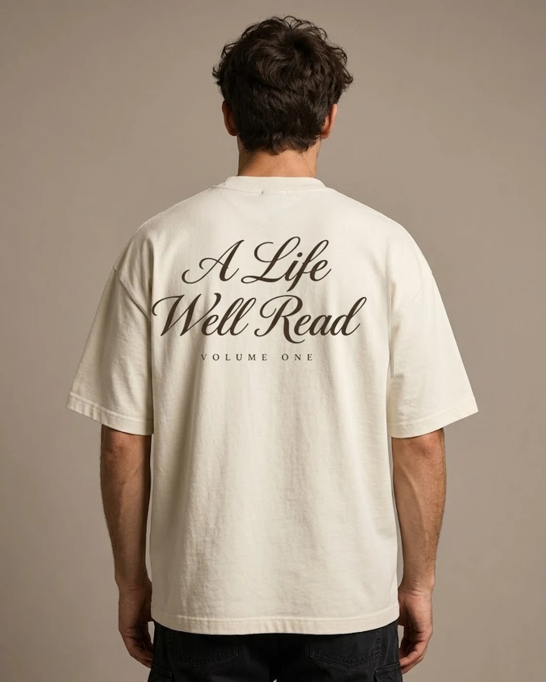 A Life Well Read cream oversized tee worn, back print view