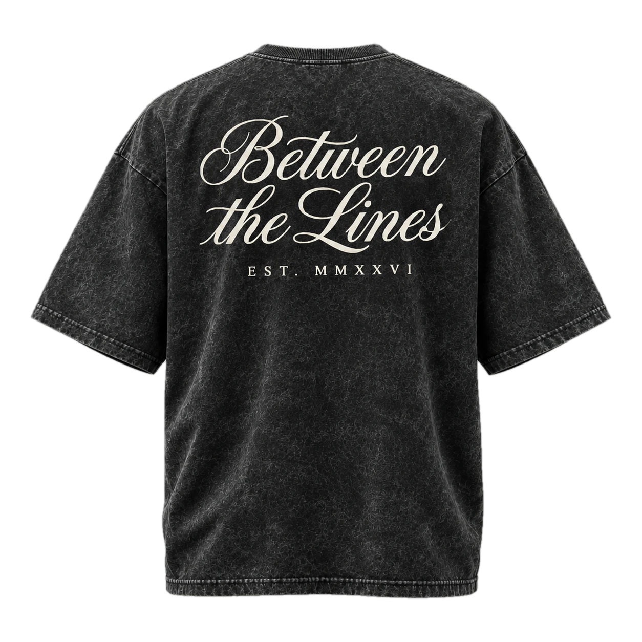 Between the Lines acid-wash black oversized tee, back, with cream script artwork