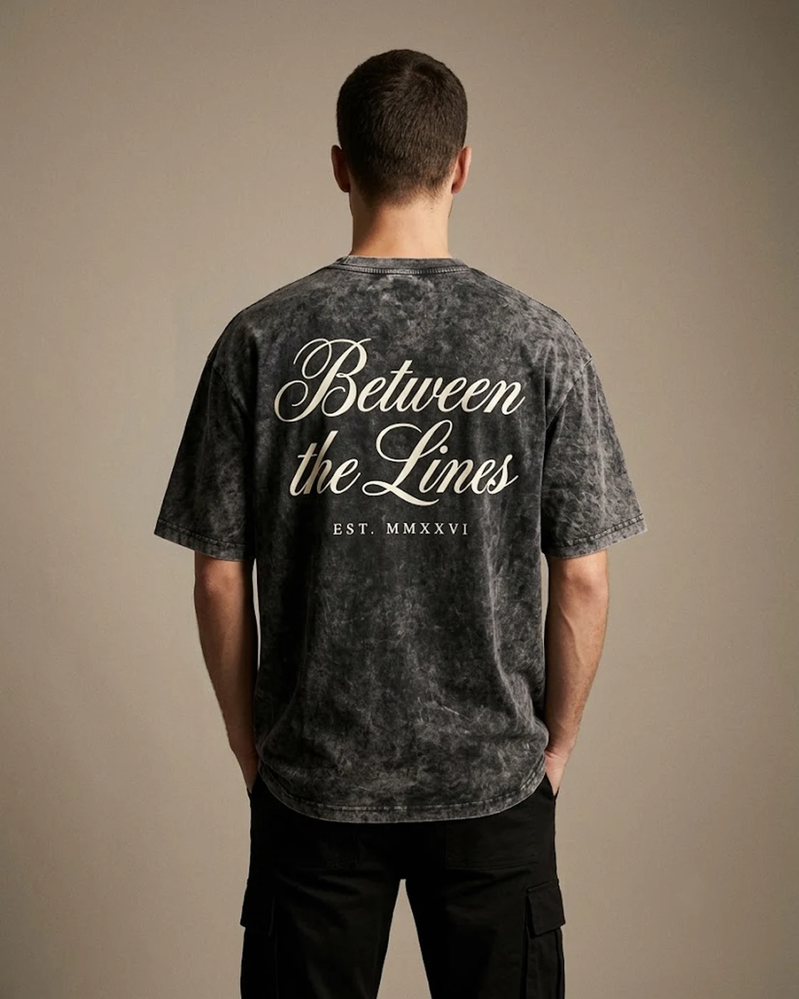 Between the Lines acid-wash black oversized tee worn, back print view