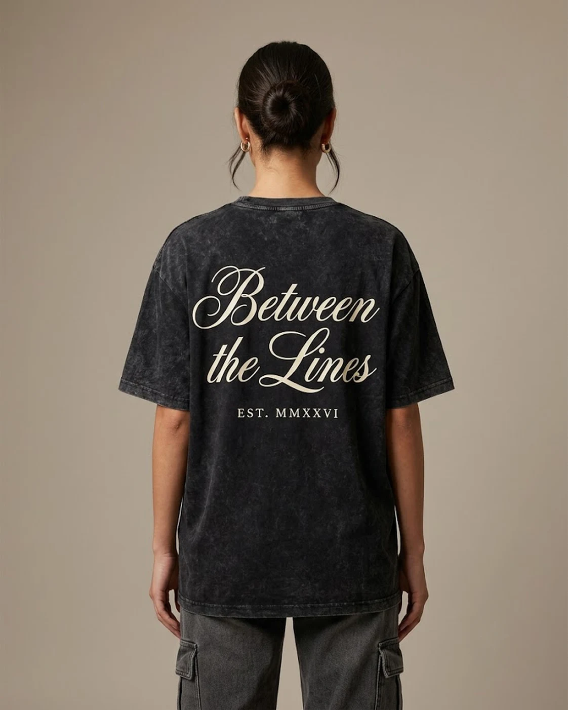 Between the Lines acid-wash black oversized tee worn, back print view, styled