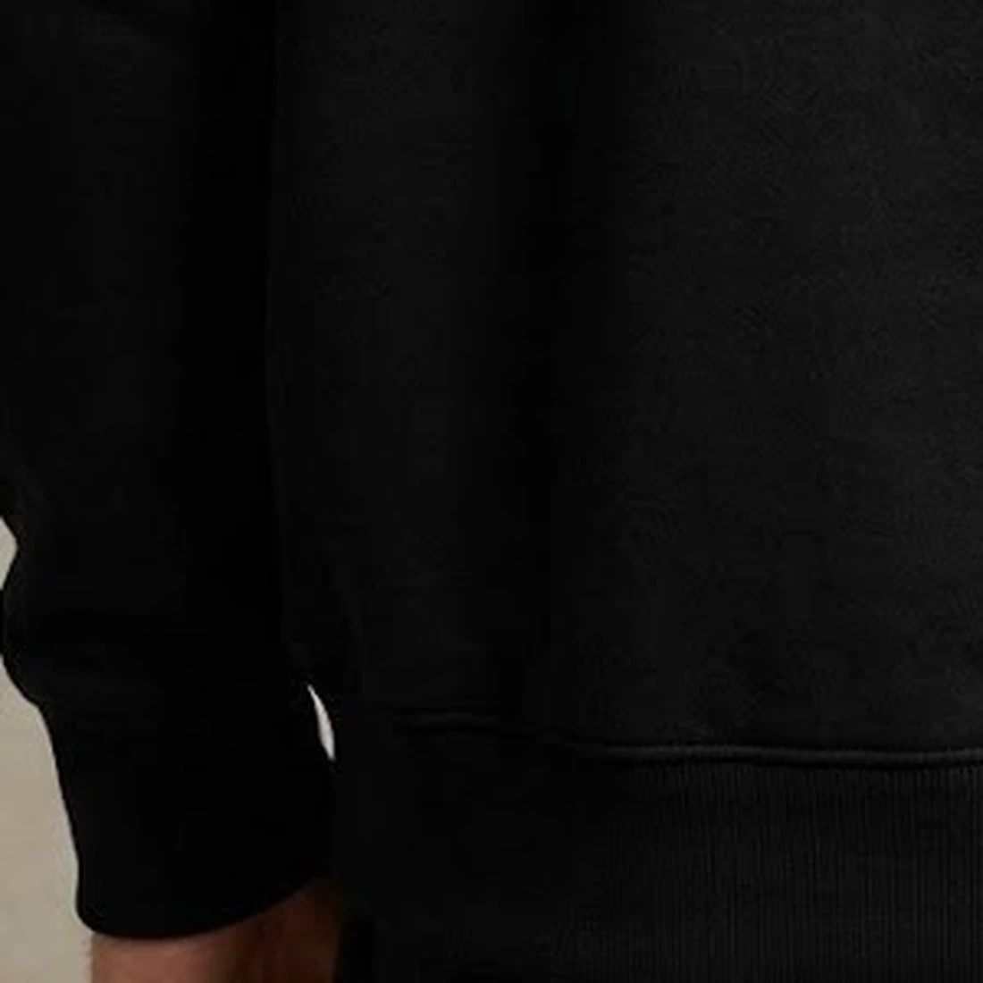 Monogram hoodie, close view of the 440 GSM brushed loopknit fabric